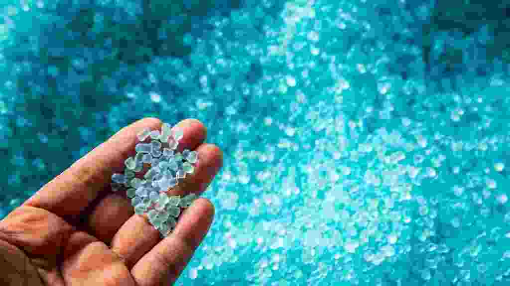 A,Hand,Hold,Or,Touching,Plastic,Pellets,,,Plastic,Polymer