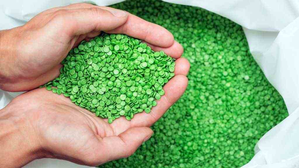 A,Hands,Hold,Or,Touching,Biodegradable,Plastic,Pellets,,Plastic,Polymer